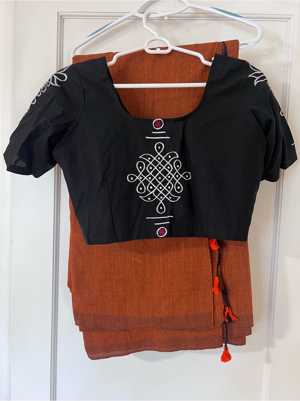 Orange and Black Saree and Embroidered Black Choli Top